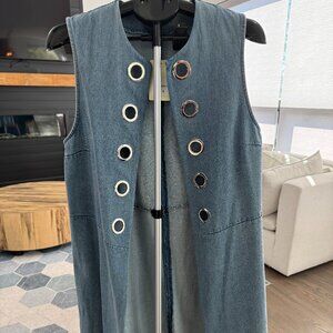 Dor Dor sleeveless denim vest with large metal grommets.